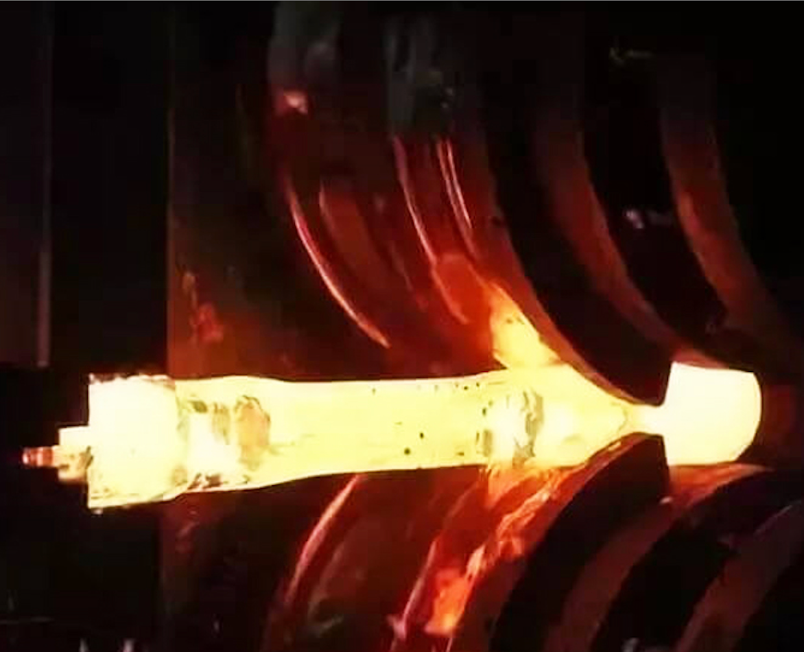 Forging process of heated metal billet, shaping with roll forging machine